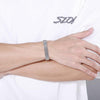 Silver Manly Mania Core Bracelet mockup on male wrist – Luxury stainless steel mens bracelet