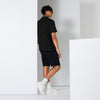 Back view of Manly Mania Giant Polo Shirt in Black